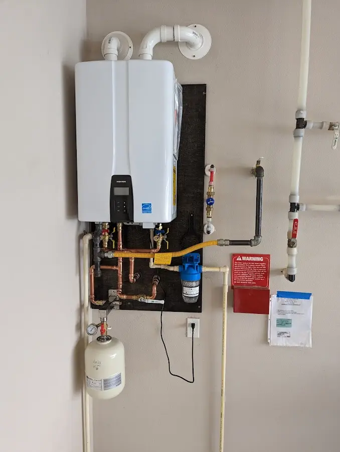 Professional plumber installing copper piping in a Orangeville home